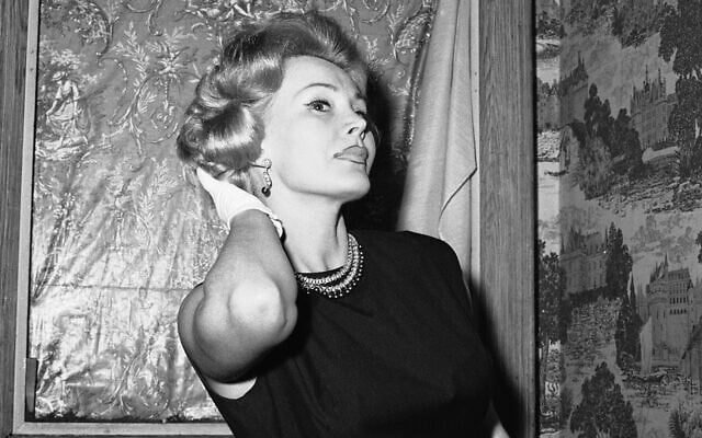 Zsa Zsa Gabor primps her hair as she leaves her hairdresser in New York on May 10, 1958. (AP Photo/John Lent) Zsa Zsa Gabor primps her hair as she leaves her hairdresser in New York on May 10, 1958. (AP Photo/John Lent)