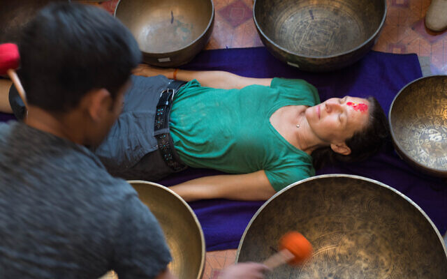 Deborah Copaken undergoing sound bowl therapy in Kathmandu, July 2017 (Stephen Douglas Alexander)