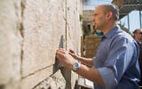 Current Prime Minister Naftali Bennett prays at the Western Wall in Jerusalem's Old City on March 16, 2015. (Yonatan Sindel/Flash90)