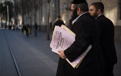 Representatives of the Chief Rabbinate deliver a kashrut certificate to a local restaurant in central Jerusalem, on December 31, 2019. (Hadas Parush/Flash90)