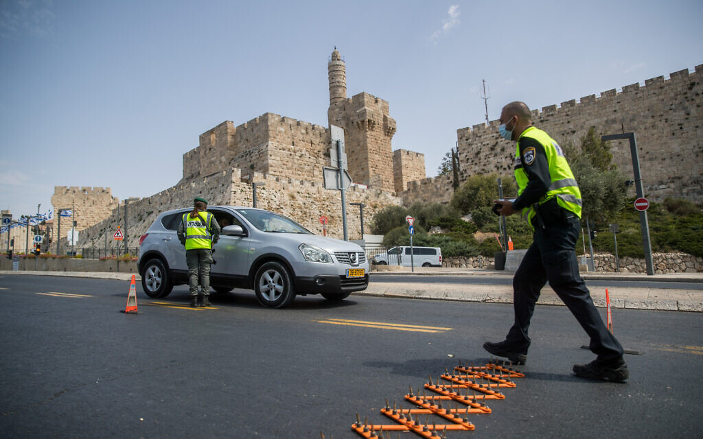 Police at a temporary checkpoint outside Jerusalem's Old City, on September 19, 2020, during a nationwide lockdown on Rosh Hashana. (Yonatan Sindel/Flash90) Police at a temporary checkpoint outside Jerusalem's Old City, on September 19, 2020, during a nationwide lockdown on Rosh Hashana. (Yonatan Sindel/Flash90)
