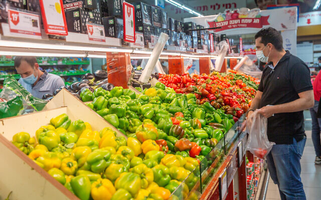 People shop for groceries at the Rami Levy supermarket in Modiin as Israel entered a new major coronavirus lockdown September 24, 2020. (Yossi Aloni/Flash90) People shop for groceries at the Rami Levy supermarket in Modiin as Israel entered a new major coronavirus lockdown September 24, 2020. (Yossi Aloni/Flash90)
