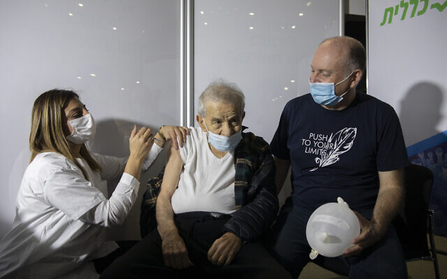 Illustrative: An elderly man receives a COVID-19 vaccine at the Clalit vaccination center in Jerusalem, on January 4, 2021. (Olivier Fitoussi/Flash90) Illustrative: An elderly man receives a COVID-19 vaccine at the Clalit vaccination center in Jerusalem, on January 4, 2021. (Olivier Fitoussi/Flash90)
