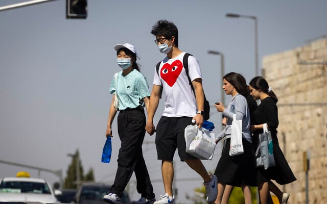People. some with face masks. in Jerusalem on June 29, 2021. (Olivier Fitoussi/Flash90) People. some with face masks. in Jerusalem on June 29, 2021. (Olivier Fitoussi/Flash90)