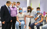 Prime Minister Naftali Bennett and Minister of Health Nitzan Horowitz attend a press conference at a Maccabi vaccination center in Holon on June 29, 2021. (Marc Israel Sellem/ Pool via Flash90)