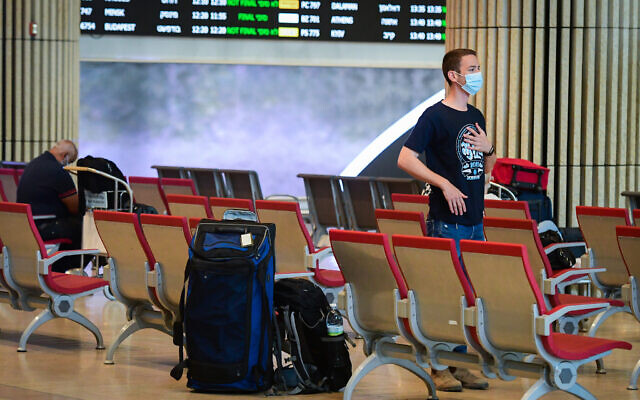 Travelers are seen in the arrival hall of Ben Gurion International Airport, on June 30, 2021. (Avshalom Sassoni/Flash90) Travelers are seen in the arrival hall of Ben Gurion International Airport, on June 30, 2021. (Avshalom Sassoni/Flash90)