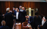 Members of the opposition argue during a discussion on a law regarding unemployment payouts during a plenum session in the Knesset in Jerusalem on July 1, 2021. (Yonatan Sindel/FLASH90)