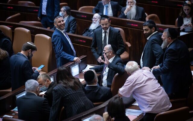Opposition members rejoice after a Knesset vote rejected an extension of the Palestinian family reunification law, in Jerusalem, on July 6, 2021. (Yonatan Sindel/Flash90) Opposition members rejoice after a Knesset vote rejected an extension of the Palestinian family reunification law, in Jerusalem, on July 6, 2021. (Yonatan Sindel/Flash90)