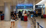 Travelers at Ben Gurion International Airport, on June 30, 2021, heading for COVID-19 tests. (Nati Shohat/Flash90)