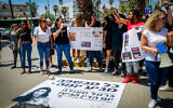 Parents and supporters protest outside a court hearing of Carmel Mauda in Lod on July 8, 2021. (Avshalom Sassoni/Flash90)