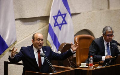 Prime Minister Naftali Bennett speaks during a plenum session in the Knesset on July 12, 2021. (Olivier Fitoussi/Flash90)