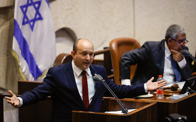 Prime Minister Naftali Bennett speaks during a plenum session in the assembly hall of the Israeli parliament, on July 12, 2021. (Olivier Fitoussi/Flash90)