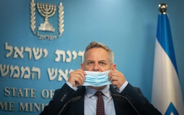Health Minister Nitzan Horowitz holds a press conference, together with Prime Minister Naftali Bennett (not seen) at the Prime Minister's Office in Jerusalem on July 14, 2021. (Noam Revkin Fenton/FLASH90)