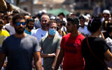 A man wears a facemask at the Mahane Yehuda market in Jerusalem on June 15, 2021. (Olivier Fitoussi/Flash90)