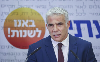 Head of the Yesh Atid party Yair Lapid speaks during a faction meeting at the Knesset in Jerusalem, on July 19, 2021. (Yonatan Sindel/Flash90)