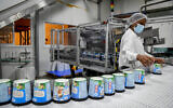 Workers at the Ben and Jerry's factory near Kiryat Malachi, on July 21, 2021. (Flash90)