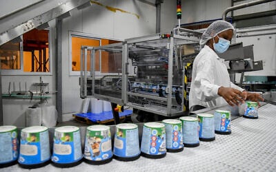 Workers at the Ben and Jerry's factory near Kiryat Malachi, on July 21, 2021. (Flash90)