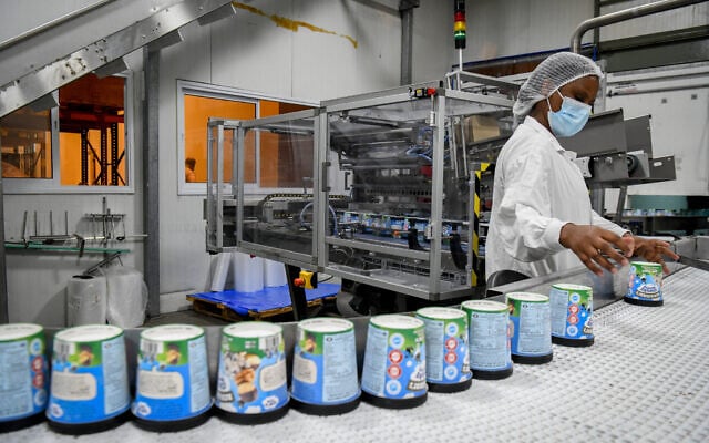 Workers at the Ben and Jerry's factory near Kiryat Malachi, on July 21, 2021. (Flash90) Workers at the Ben and Jerry's factory near Kiryat Malachi, on July 21, 2021. (Flash90)