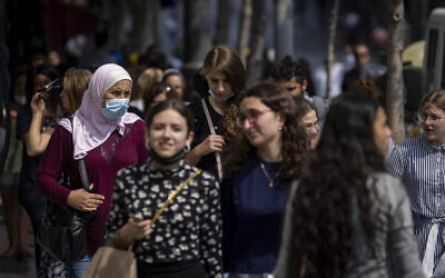 People, some wearing face masks, walk on Jaffa Street in Jerusalem, July 25, 2021. (Olivier Fitoussi/Flash90) People, some wearing face masks, walk on Jaffa Street in Jerusalem, July 25, 2021. (Olivier Fitoussi/Flash90)