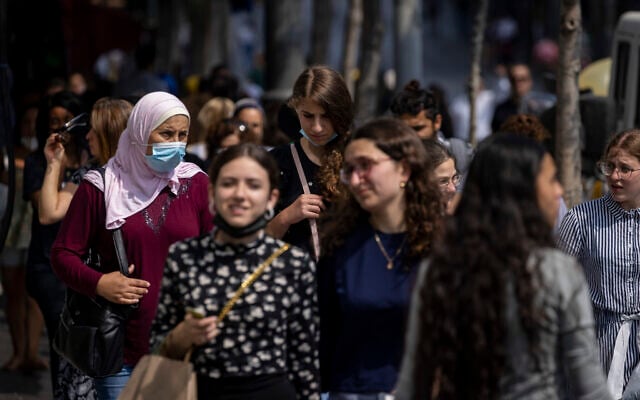 People, some wearing face masks, walk on Jaffa Street in Jerusalem, July 25, 2021. (Olivier Fitoussi/Flash90) People, some wearing face masks, walk on Jaffa Street in Jerusalem, July 25, 2021. (Olivier Fitoussi/Flash90)