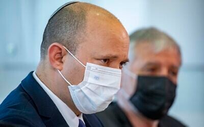 Prime Minister Naftali Bennett visits at 'Migdal Nofim' retirement home in Jerusalem, July 27, 2021. (Olivier Fitoussi/Flash90)