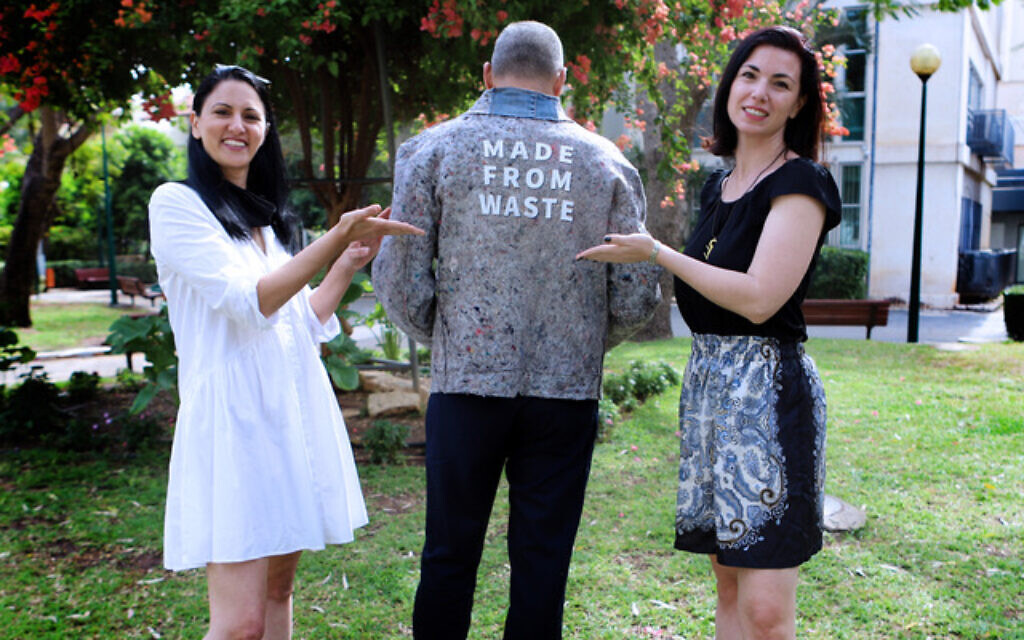 Revital Nadiv (left) and Viktoria Kanar, founders of textile innovation organization Re-Fresh Global, with designer Doron Ashkenazi jacket made from recycled fabric (Courtesy Re-Fresh Global) Revital Nadiv (left) and Viktoria Kanar, founders of textile innovation organization Re-Fresh Global, with designer Doron Ashkenazi jacket made from recycled fabric (Courtesy Re-Fresh Global)
