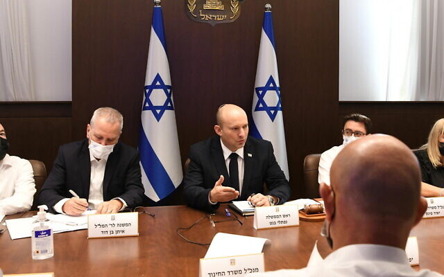 Prime Minister Naftali Bennett meets with officials at his office in Jerusalem to discuss plans for reopening of schools, July 25, 2021. (Amos Ben Gershom/GPO) Prime Minister Naftali Bennett meets with officials at his office in Jerusalem to discuss plans for reopening of schools, July 25, 2021. (Amos Ben Gershom/GPO)