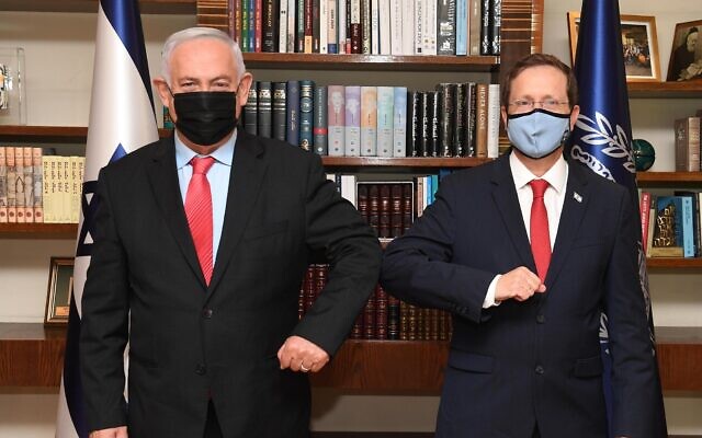 President Isaac Herzog (R) and Opposition Leader Benjamin Netanyahu pose for a photo during a meeting at the President's Residence in Jerusalem, July 25, 2021. (Mark Neyman/GPO) President Isaac Herzog (R) and Opposition Leader Benjamin Netanyahu pose for a photo during a meeting at the President's Residence in Jerusalem, July 25, 2021. (Mark Neyman/GPO)