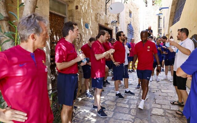 Retired players from Spanish soccer league rivals FC Barcelona and Real Madrid CF toured the ancient port city of Jaffa on July 20, 2021, ahead of the planned exhibition match at Jaffa's Bloomfield Stadium. (Courtesy: Guy Yechiely)