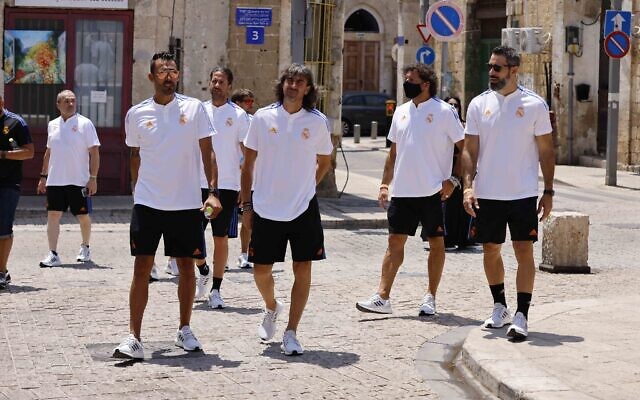 Retired players from Spanish soccer league rivals FC Barcelona and Real Madrid CF toured the ancient port city of Jaffa on July 20, 2021, ahead of the planned exhibition match at Jaffa's Bloomfield Stadium. (Courtesy: Guy Yechiely)
