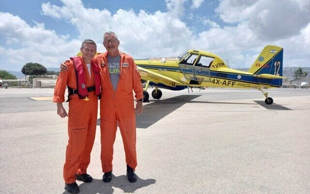 Two IDF officials who are taking part in the delegation to help battle a fire in Cyprus, ahead of their departure on July 4, 2021. (Israel Firefighting Services) Two IDF officials who are taking part in the delegation to help battle a fire in Cyprus, ahead of their departure on July 4, 2021. (Israel Firefighting Services)