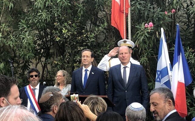 President Isaac Herzog (L) at Bastille Day celebrations at the French ambassador’s residence in Jaffa, July 14, 2021. (Lazar Berman/Times of Israel) President Isaac Herzog (L) at Bastille Day celebrations at the French ambassador’s residence in Jaffa, July 14, 2021. (Lazar Berman/Times of Israel)