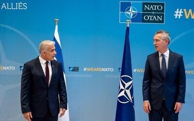 Foreign Minister Yair Lapid meets with NATO Secretary General Jens Stoltenberg in Brussels, July 12, 2021 (NATO)