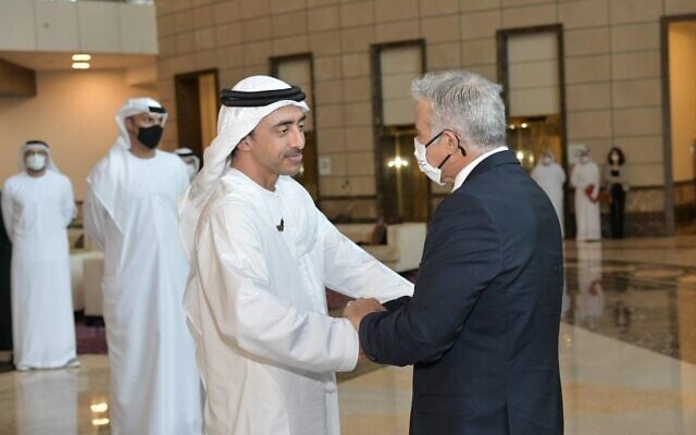 Foreign Minister Yair Lapid shakes hands with UAE Foreign Minister Abdullah bin Zayed al Nahyan in Abu Dhabi, on June 29, 2021. (Shlomi Amsalem GPO) Foreign Minister Yair Lapid shakes hands with UAE Foreign Minister Abdullah bin Zayed al Nahyan in Abu Dhabi, on June 29, 2021. (Shlomi Amsalem GPO)