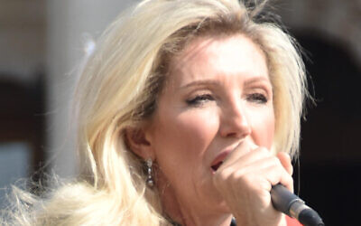 British conspiracy theorist Kate Shemirani, a former nurse, addresses a crowd of hundreds of conspiracy theorists at a rally at London's Trafalgar Square. (File: Salim Fadhley / Wikipedia) British conspiracy theorist Kate Shemirani, a former nurse, addresses a crowd of hundreds of conspiracy theorists at a rally at London's Trafalgar Square. (File: Salim Fadhley / Wikipedia)