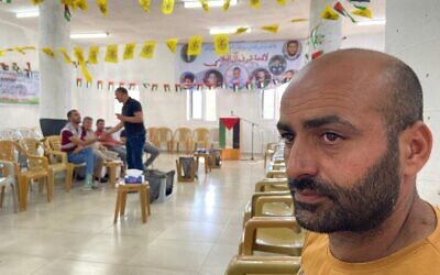 Muayyad Bahjat al-Alaama, whose son was allegedly killed after a case of mistaken identity by Israeli soldiers, at a mourning tent in his hometown of Beit Ummar in the West Bank, on Thursday, July 29, 2021 (Aaron Boxerman/The Times of Israel)