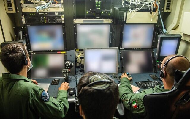 Italian drone pilots fly a Hermes-450 unmanned aerial vehicle while an Israeli operator watches during an international exercise, dubbed Blue Guardian, which launched on July 12, 2021. (Israel Defense Forces) Italian drone pilots fly a Hermes-450 unmanned aerial vehicle while an Israeli operator watches during an international exercise, dubbed Blue Guardian, which launched on July 12, 2021. (Israel Defense Forces)