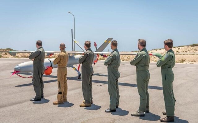 Drone pilots from five countries and Israel pose in front of a Hermes-450 unmanned aerial vehicle during an international exercise, dubbed Blue Guardian, which launched on July 12, 2021. (Israel Defense Forces) Drone pilots from five countries and Israel pose in front of a Hermes-450 unmanned aerial vehicle during an international exercise, dubbed Blue Guardian, which launched on July 12, 2021. (Israel Defense Forces)