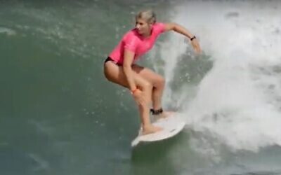 Anat Lelior surfs in video uploaded Oct 30, 2019 (Screen grab/Haaretz)