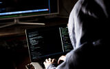An illustrative image of a hacker (Михаил Руденко; iStock by Getty Images)