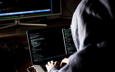 An illustrative image of a hacker (Михаил Руденко; iStock by Getty Images)