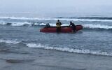 Fire and Rescue Services volunteers search for a 10-year-old boy who went missing at sea near Acre, July 25, 2021. (Fire and Rescue Services)