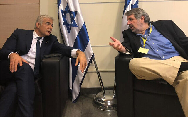 Yesh Atid leader Yair Lapid (L) and political strategist Mark Mellman in the Knesset before the swearing in of Israel's 36th government, June 13, 2021. (Yesh Atid) Yesh Atid leader Yair Lapid (L) and political strategist Mark Mellman in the Knesset before the swearing in of Israel's 36th government, June 13, 2021. (Yesh Atid)