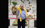 Rabbi Natan Slifkin holds Shayna, an albino Burmese python. (The Biblical Museum of Natural History)