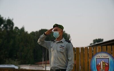 Col. Oren Simcha salutes during a ceremony on July 7, 2020. (Israel Defense Forces)