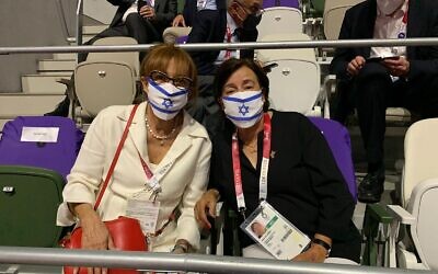 Ankie Spitzer and Ilana Romano, widows of Andre Spitzer and Yoseff Romano, who were murdered in the 1972 Munich massacre, take part in the Tokyo 2020 Olympics opening ceremony, July 23, 221, at which a moment of silence was held for Israel's 1972 Olympic massacre victims (Courtesy)