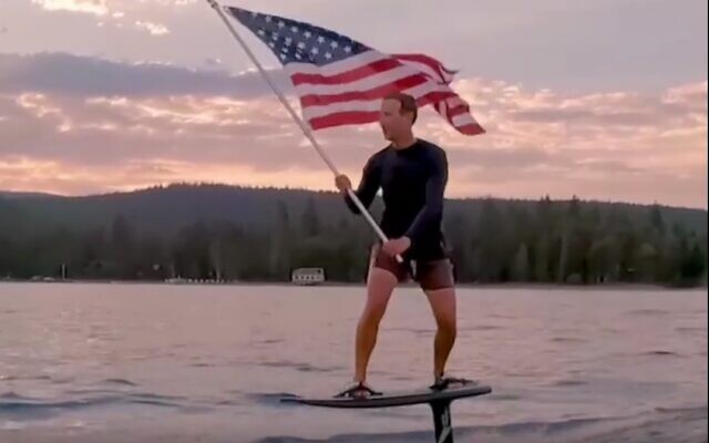 Facebook CEO Mark Zuckerberg surfs on an electric hydroboard while waving an American flag in a July 4 video (Screenshot) Facebook CEO Mark Zuckerberg surfs on an electric hydroboard while waving an American flag in a July 4 video (Screenshot)