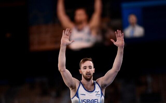 Israel's Artem Dolgopyat celebrates after competin in the floor event of the artistic gymnastics men's floor exercise final during the Tokyo 2020 Olympic Games at the Ariake Gymnastics Centre in Tokyo on August 1, 2021. (Loic VENANCE / AFP)