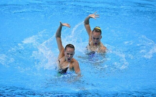 Israel's Eden Blecher and Israel's Shelly Bobritsky compete in the preliminary for the women's duet free artistic swimming event during the Tokyo 2020 Olympic Games at the Tokyo Aquatics Centre in Tokyo on August 2, 2021. (Photo by Oli SCARFF / AFP)