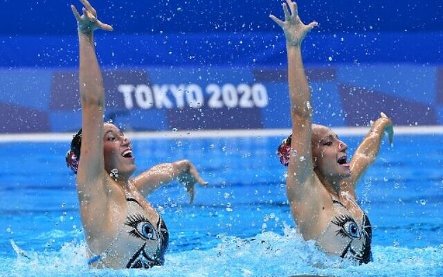 Israel's Eden Blecher and Israel's Shelly Bobritsky compete in the preliminary for the women's duet free artistic swimming event during the Tokyo 2020 Olympic Games at the Tokyo Aquatics Centre in Tokyo on August 2, 2021. (Photo by Attila KISBENEDEK / AFP)